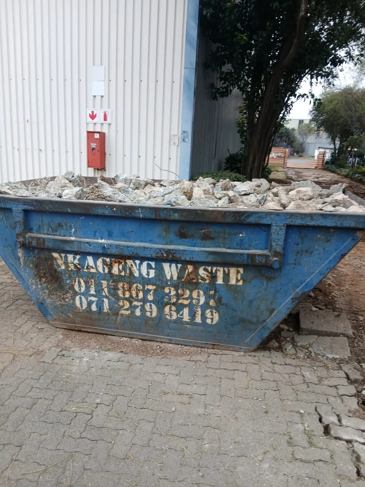 Nkageng Waste skip filled with clean building rubble
