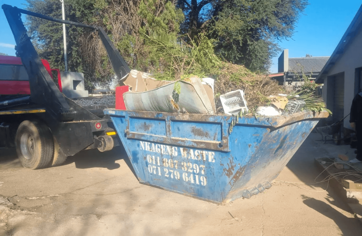 Nkageng Waste skip filled with garden waste at a residential property